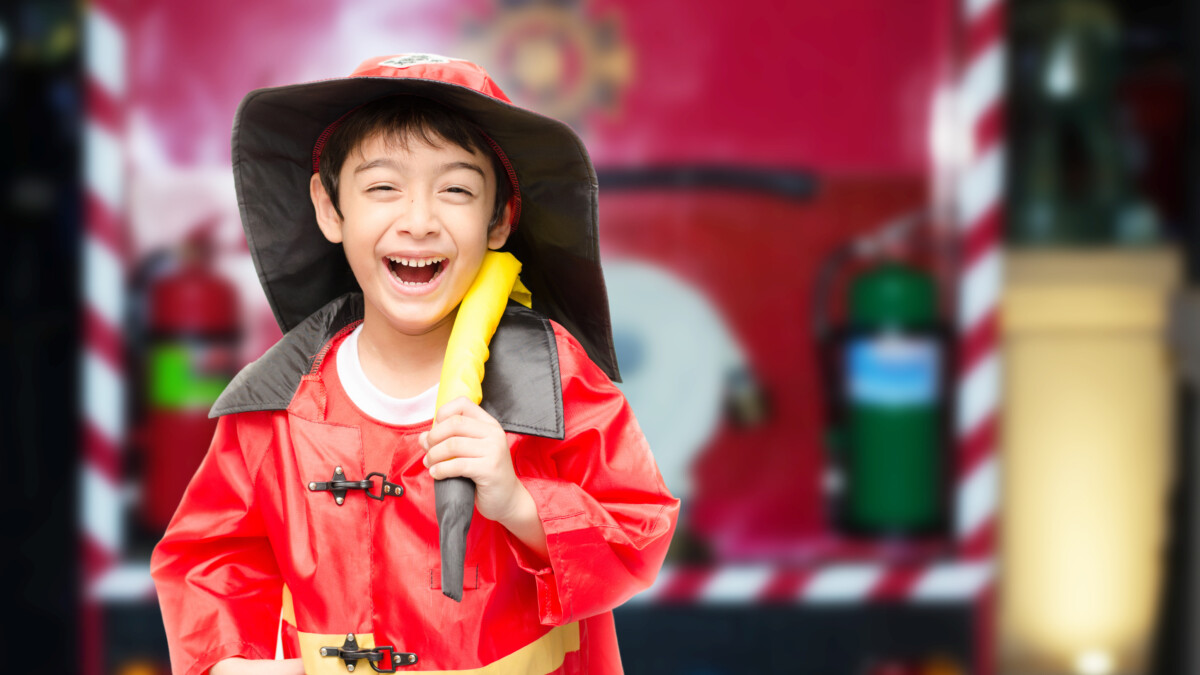 Little boy dressed as a fire fighter